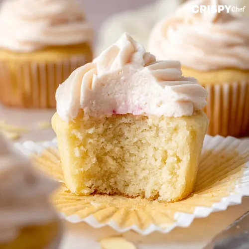 Almond Wedding Cake Cupcakes with Raspberry Filling