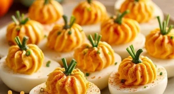 Festive Pumpkin Patch Deviled Eggs served on a platter.