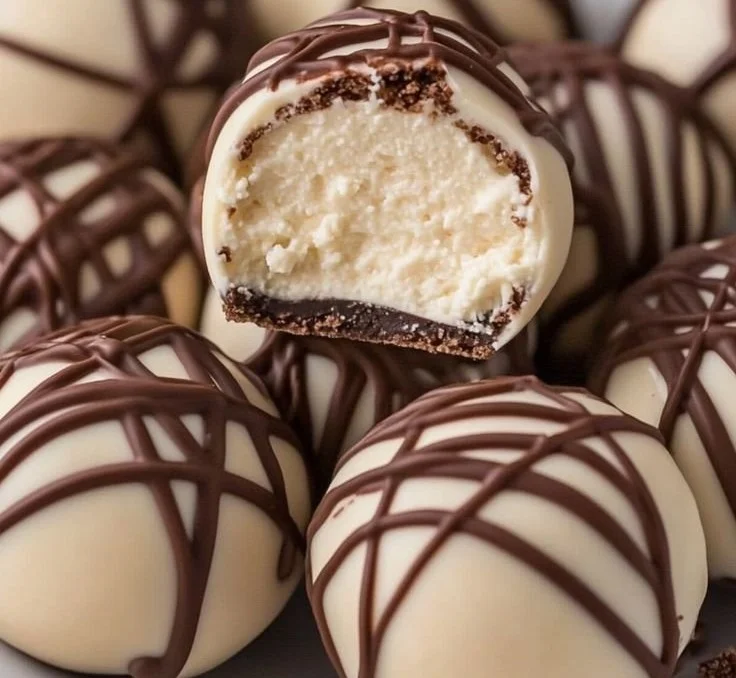 Delicious Baileys cheesecake balls on a decorative plate.