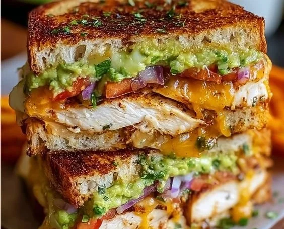 Delicious Chicken Avocado Melt Sandwich with chicken, avocado, and melted cheese