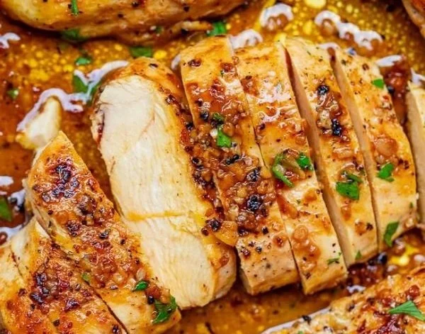 Delicious skillet garlic butter chicken garnished with herbs