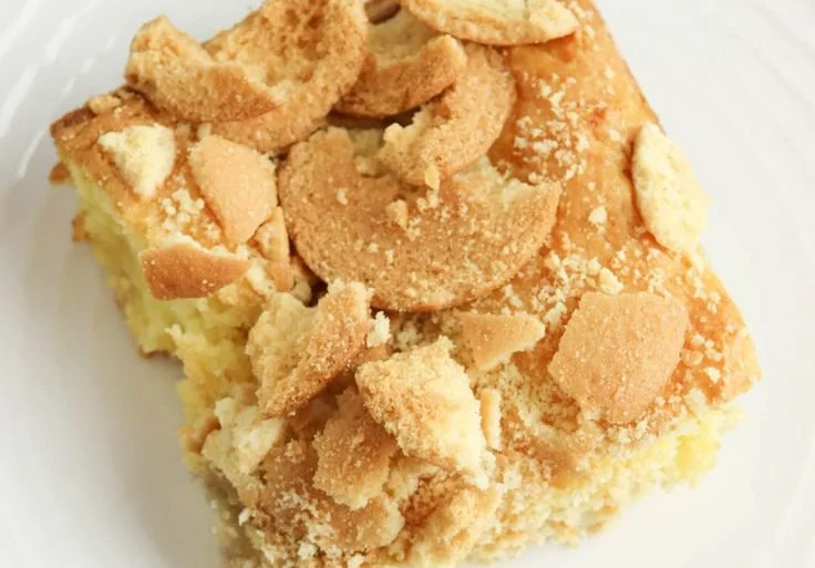 Delicious banana pudding brownies topped with whipped cream and banana slices