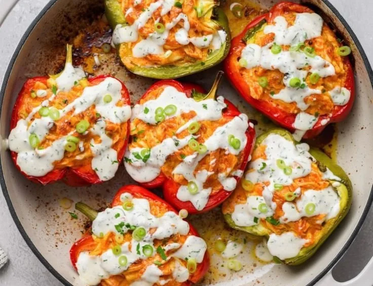 Dairy free buffalo chicken stuffed peppers served on a plate