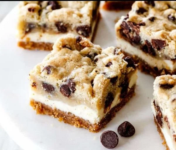 Delicious chocolate chip cheesecake bars served on a plate