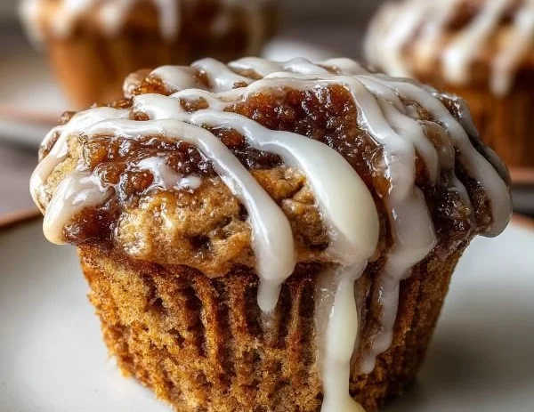 Delicious cinnamon roll protein muffins topped with sweet icing
