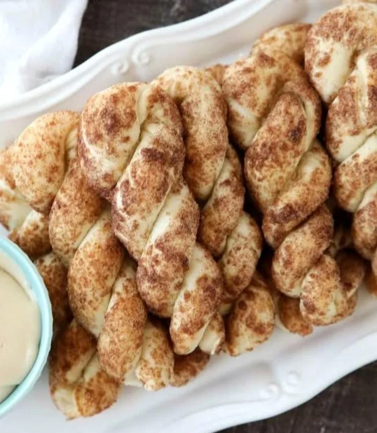 Freshly baked Cinnamon Twists with a sugary glaze and cinnamon topping
