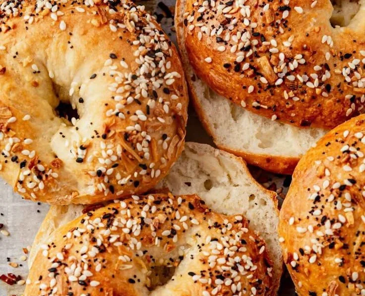 Delicious cottage cheese protein bagel topped with fresh herbs and veggies