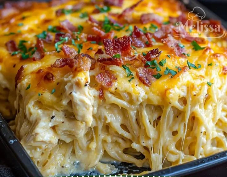 Creamy Southern spaghetti bake topped with cheese and herbs