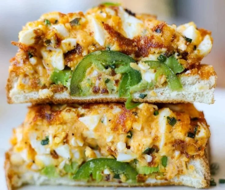 Crispy egg salad served on a plate with fresh ingredients and herbs