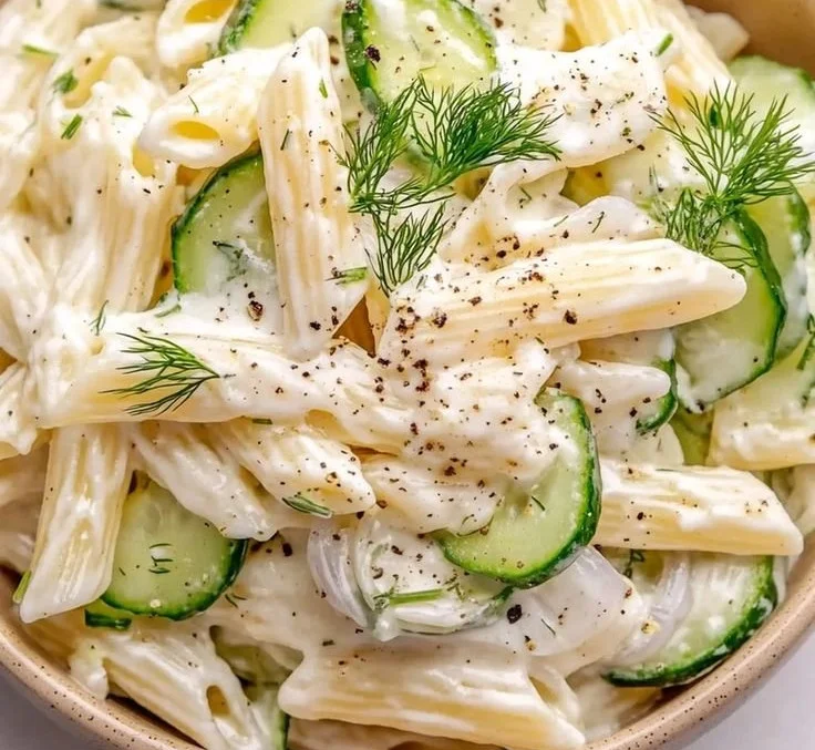 Delicious cucumber pasta salad with fresh vegetables and dressing