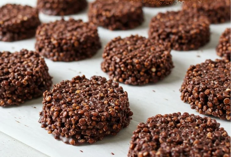 Delicious dark chocolate quinoa crisps in a bowl, perfect for healthy snacking.