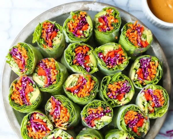 Fresh spring rolls served with creamy peanut sauce for dipping
