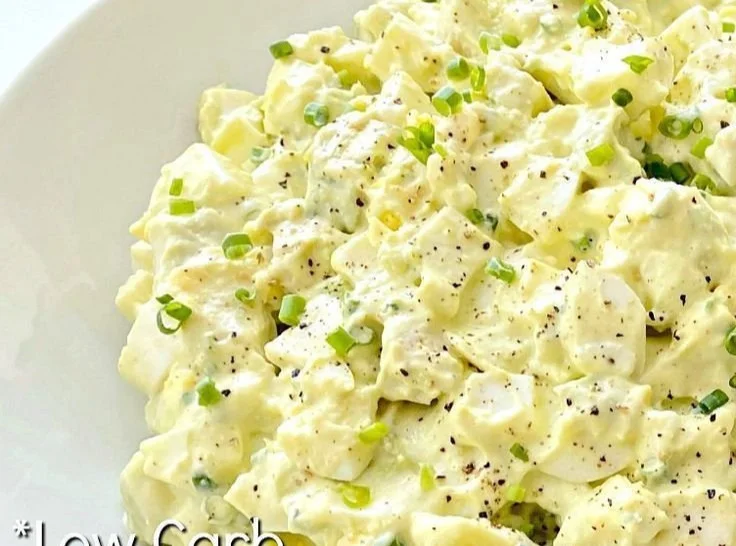 Keto Avocado Egg Salad made with eggs, avocado, and spices in a bowl.