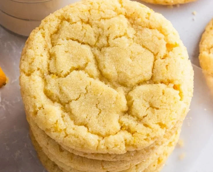 Freshly baked lemon sugar cookies on a cooling rack