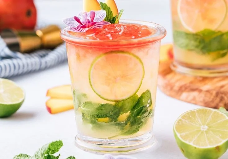 Refreshing Mango Rum Swizzle cocktail garnished with fruit