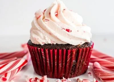Delicious peppermint cupcakes with buttercream frosting on a festive plate