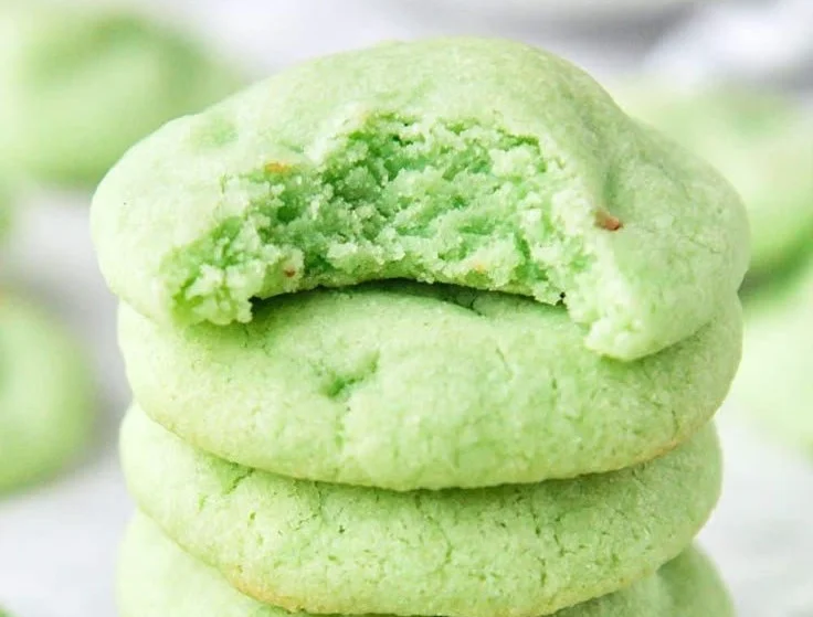 Freshly baked pistachio pudding cookies on a cooling rack
