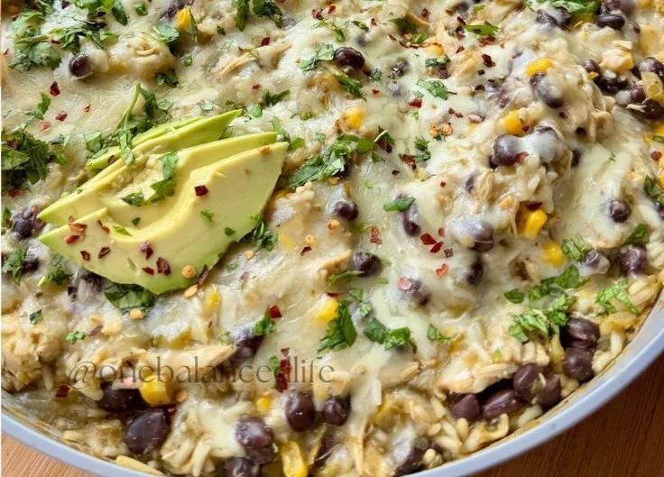 Delicious Salsa Verde Chicken & Rice Skillet served in a bowl with fresh herbs