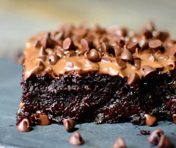 Decadent and healthy zucchini brownies served on a white plate