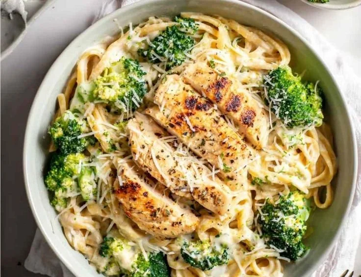Bowl of Skinny Chicken Broccoli Alfredo topped with parsley