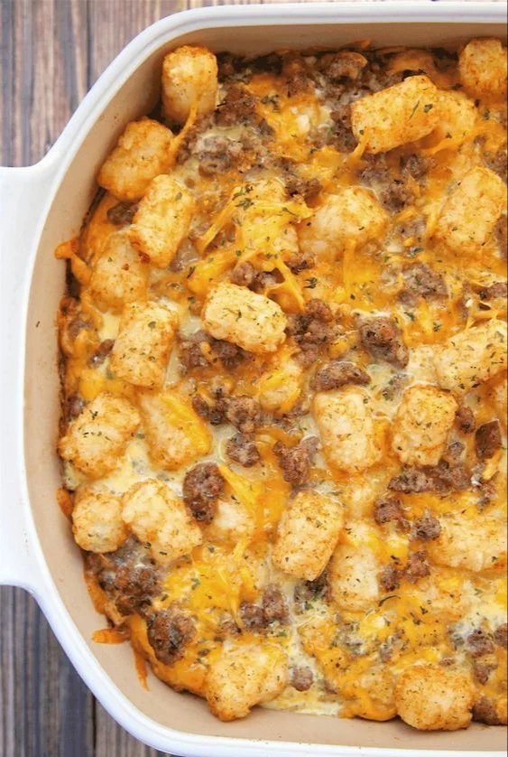 Tater Tot Sausage Breakfast Casserole baked in a dish with toppings