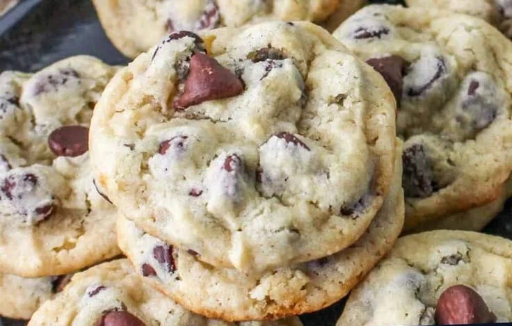Homemade yogurt chocolate chip cookies cooling on a baking tray